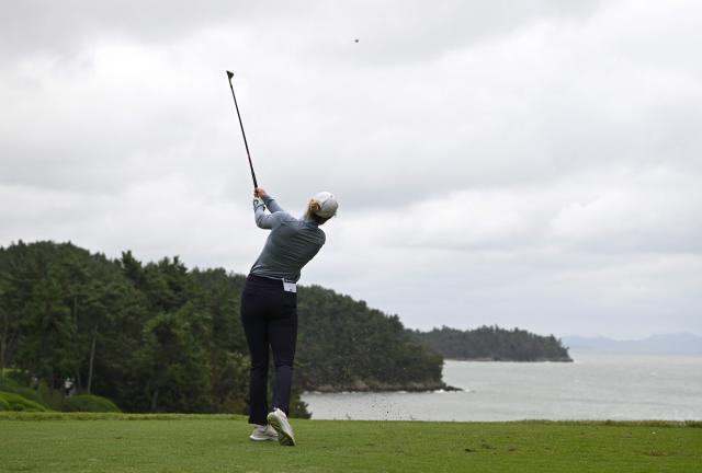 Brooke Matthews of the United States tees off on the 8th hole during the third round of the LPGA Tour - BMW Ladies Championship golf tournament at Pine Beach Golf Links in Haenam on October 18, 2025. (Photo by Jung Yeon-je / AFP)