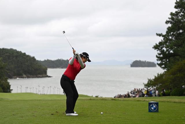 Kim Sei-young of South Korea tees off on the 8th hole during the third round of the LPGA Tour - BMW Ladies Championship golf tournament at Pine Beach Golf Links in Haenam on October 18, 2025. (Photo by Jung Yeon-je / AFP)
