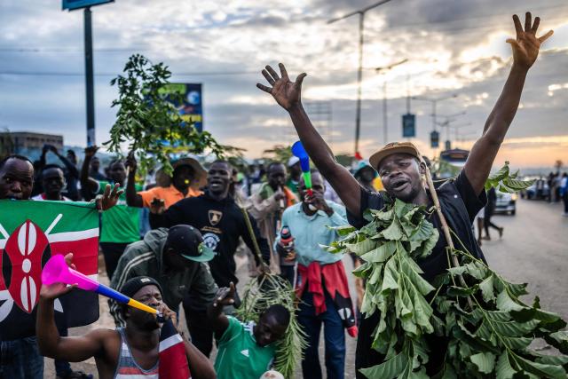 Mourners and supporters of Kenya’s opposition leader and former Prime Minister Raila Odinga chant slogans and express grief as they gather ahead of the arrival of his coffin to his home region in Kisumu, on October 18, 2025. Vast crowds gathered in western Kenya on October 18, 2025 to see the body of a beloved politician, Raila Odinga, for the biggest day of mourning ceremonies. (Photo by Luis TATO / AFP)