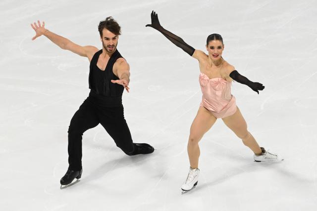 France's pair figure skaters Laurence Fournier-Beaudry and Guillaume Cizeron perform during the Ice Dance Rhythm Dance event of the ISU 2025 figure skating French Grand Prix in Angers, western France, on October 18, 2025. (Photo by JEAN-FRANCOIS MONIER / AFP)