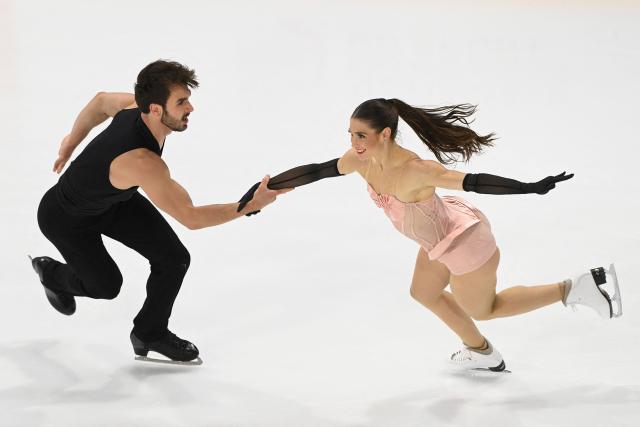 France's pair figure skaters Laurence Fournier-Beaudry and Guillaume Cizeron perform during the Ice Dance Rhythm Dance event of the ISU 2025 figure skating French Grand Prix in Angers, western France, on October 18, 2025. (Photo by JEAN-FRANCOIS MONIER / AFP)