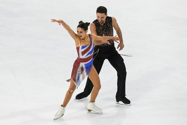 Britain's pair figure skaters Lilah Fear and Lewis Gibson perform during the Ice Dance Rhythm Dance event of the ISU 2025 figure skating French Grand Prix in Angers, western France, on October 18, 2025. (Photo by JEAN-FRANCOIS MONIER / AFP)