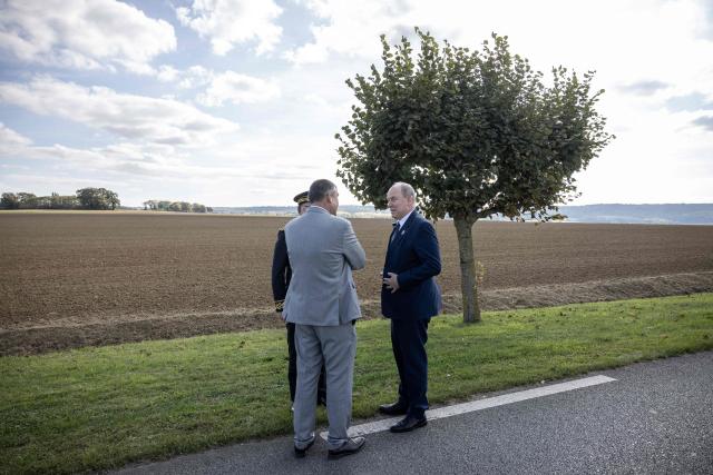 Prince Albert II of Monaco (R) is welcomed by Guiscard mayor Thibault Delavenne and Compiegne's subprefect Christian Guyard before unveiling a plaque marking the city's as member of the Grimaldi Monaco historical sites, in Guiscard on October 18, 2025. (Photo by Guillaume BAPTISTE / AFP)