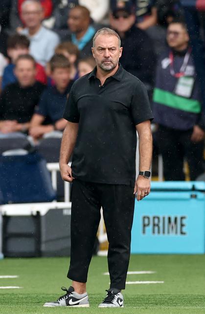 Barcelona's German coach Hans-Dieter Flick watches his players from the touchline during the Spanish league football match between FC Barcelona and Girona FC at Estadi Olimpic Lluis Companys in Barcelona on October 18, 2025. (Photo by Josep LAGO / AFP)