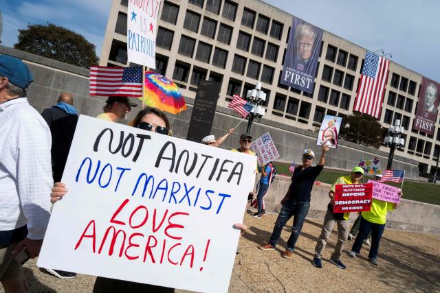 People participate in a "No Kings" national day of protest in New York on October 18, 2025. From New York to San Francisco, millions of Americans are expected to hit the streets to voice their anger over President Donald Trump's policies at nationwide "No Kings" protests. (Photo by Roberto Schmidt / AFP)
