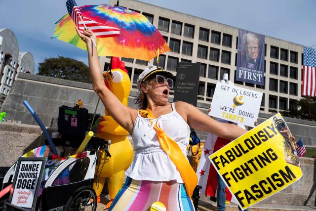 People participate in a "No Kings" national day of protest in New York on October 18, 2025. From New York to San Francisco, millions of Americans are expected to hit the streets to voice their anger over President Donald Trump's policies at nationwide "No Kings" protests. (Photo by Roberto Schmidt / AFP)