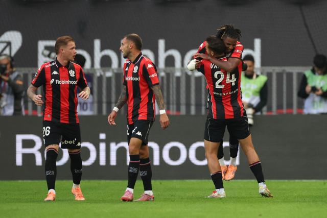 Nice's Algerian midfielder #06 Hicham Boudaoui (R) celebrates scoring his team's third goal during the French L1 football match between OGC Nice and Olympique Lyonnais at the Allianz Riviera Stadium in Nice, south-eastern France on October 18, 2025. (Photo by Valery HACHE / AFP)
