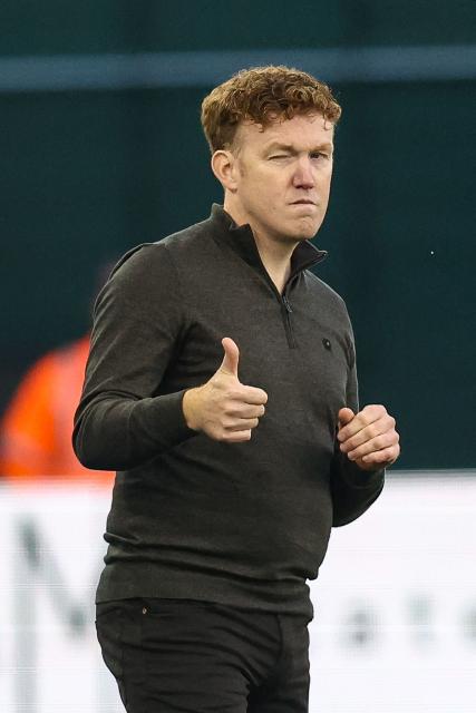 OHL's head coach Hans Somers gives the thumbs-up during a Belgian Pro League football match between Oud-Heverlee Leuven and Club Brugge KV at Den Dreef stadium in Leuven, on October 18, 2025. (Photo by BRUNO FAHY / Belga / AFP) / Belgium OUT