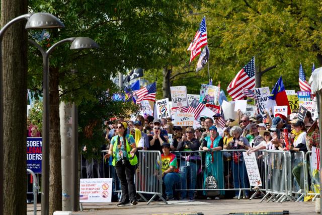 Protesters rally during the "No Kings" national day of protest in Washington, DC on October 18, 2025. From New York to San Francisco, millions of Americans are expected to hit the streets to voice their anger over President Donald Trump's policies at nationwide "No Kings" protests. (Photo by Amid FARAHI / AFP)