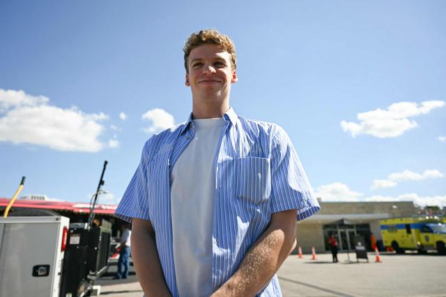 French swimmer Leon Marchand visits the paddock ahead of the qualifying session for the United States Formula One Grand Prix at the Circuit of the Americas in Austin, Texas, on October 18, 2025. (Photo by Jim WATSON / AFP)