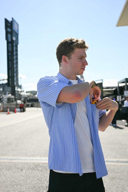 French swimmer Leon Marchand visits the paddock ahead of the qualifying session for the United States Formula One Grand Prix at the Circuit of the Americas in Austin, Texas, on October 18, 2025. (Photo by Jim WATSON / AFP)