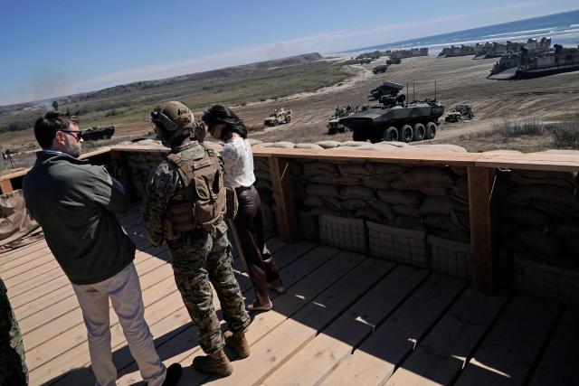 US Vice President JD Vance (L) and US Second Lady Usha Vance (R) participate in a briefing during an amphibious capabilities demonstration on Red Beach at Camp Pendleton, California, on October 18, 2025 as part of the Marine Corps' 250th anniversary celebrations. (Photo by Oliver Contreras / POOL / AFP)