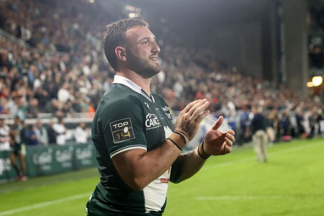 Pau's Georgian Number 8 Beka Gorgadze applauds at the end of the French Top14 rugby union match between Section Paloise Bearn Pyrenees (Pau) and Stade Toulousain Rugby (Toulouse) at Stade du Hameau in Pau, south-western France on October 18, 2025. (Photo by ROMAIN PERROCHEAU / AFP)