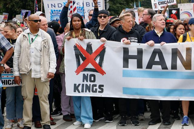 US actor John Cusack (C) attends a rally during the "No Kings" national day of protest in XX on October 18, 2025. From New York to San Francisco, millions of Americans are expected to hit the streets to voice their anger over President Donald Trump's policies at nationwide "No Kings" protests. (Photo by KAMIL KRZACZYNSKI / AFP)