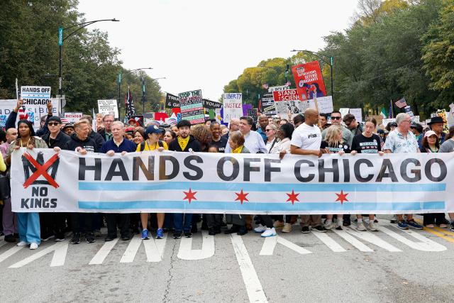 Illinois Governor JB Pritzker (C) attends a rally during the "No Kings" national day of protest in XX on October 18, 2025. From New York to San Francisco, millions of Americans are expected to hit the streets to voice their anger over President Donald Trump's policies at nationwide "No Kings" protests. (Photo by KAMIL KRZACZYNSKI / AFP)