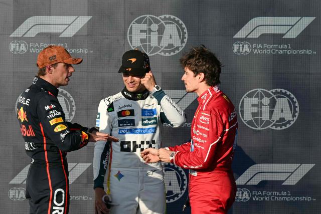 (L/R) Red Bull Racing's Dutch driver Max Verstappen, winner of the pole position, speaks with McLaren's British driver Lando Norris (L), second place, and Ferrari's Monegasque driver Charles Leclerc (R), third place, at the end of the qualifying session for the United States Formula One Grand Prix at the Circuit of the Americas in Austin, Texas, on October 18, 2025. (Photo by RONALDO SCHEMIDT / AFP)