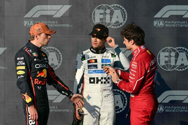(L/R) Red Bull Racing's Dutch driver Max Verstappen, winner of the pole position, speaks with McLaren's British driver Lando Norris (L), second place, and Ferrari's Monegasque driver Charles Leclerc (R), third place, at the end of the qualifying session for the United States Formula One Grand Prix at the Circuit of the Americas in Austin, Texas, on October 18, 2025. (Photo by RONALDO SCHEMIDT / AFP)