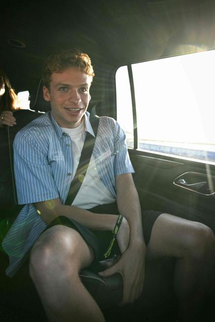 French swimmer Leon Marchand rides in a vehicle as he gets a VIP tour of the track following the qualifying session for the United States Formula One Grand Prix at the Circuit of the Americas in Austin, Texas, on October 18, 2025. (Photo by Jim WATSON / AFP)