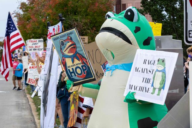 Protesters rally during the "No Kings" national day of protest in Kansas City, Missouri  on October 18, 2025. From New York to San Francisco, millions of Americans are expected to hit the streets to voice their anger over President Donald Trump's policies at nationwide "No Kings" protests. (Photo by Austin Casey Johnson / AFP)