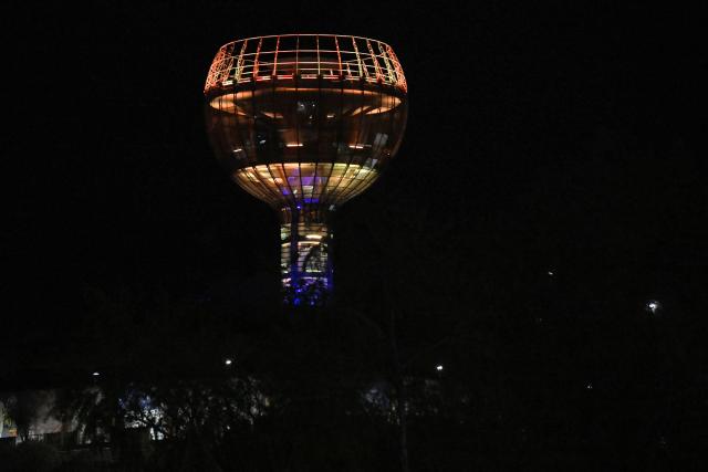 This image shows a night view of Plaza Mirador La Copa, a public square and park known for its large-scale monument shaped like a wine cup, in Tarija, Bolivia, on October 18, 2025. (Photo by AIZAR RALDES / AFP)
