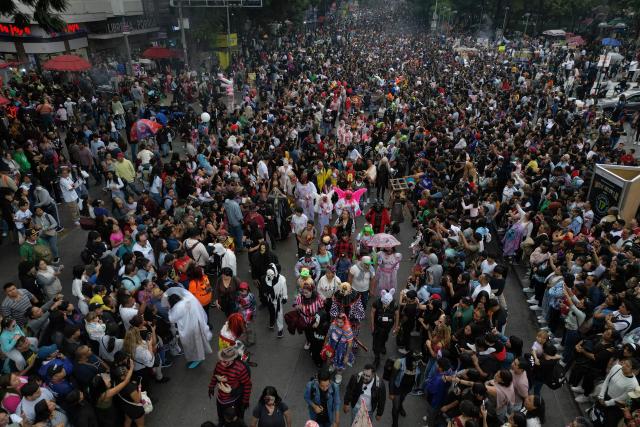 This aerial view shows the annual Zombie Parade ahead of the Day of the Dead in Mexico City on October 18, 2025. (Photo by Alfredo ESTRELLA / AFP)