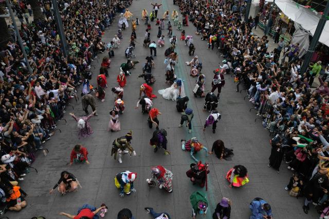This aerial view shows the annual Zombie Parade ahead of the Day of the Dead in Mexico City on October 18, 2025. (Photo by Alfredo ESTRELLA / AFP)