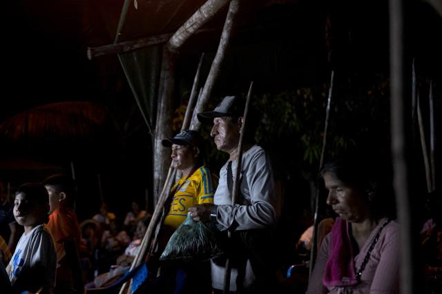 Members of the guard that protects former Bolivian president Evo Morales attend a meeting in Lauca Ene, headquarters of the coca growers movement in Chapare province, Bolivia on October 18, 2025. Bolivia chooses between two pro-business candidates in presidential elections on Sunday, ending two decades of socialist rule that have left the beleaguered South American nation deep in economic crisis. (Photo by Ernesto BENAVIDES / AFP)