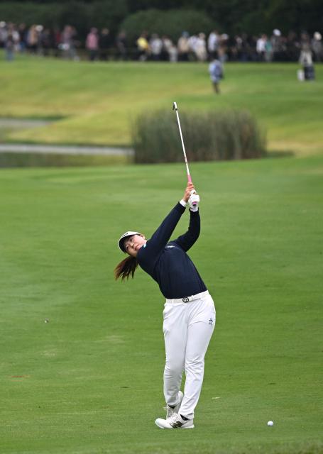 Rio Takeda of Japan plays a shot on the 4th hole during the final round of the LPGA Tour - BMW Ladies Championship golf tournament at Pine Beach Golf Links in Haenam on October 19, 2025. (Photo by Jung Yeon-je / AFP)
