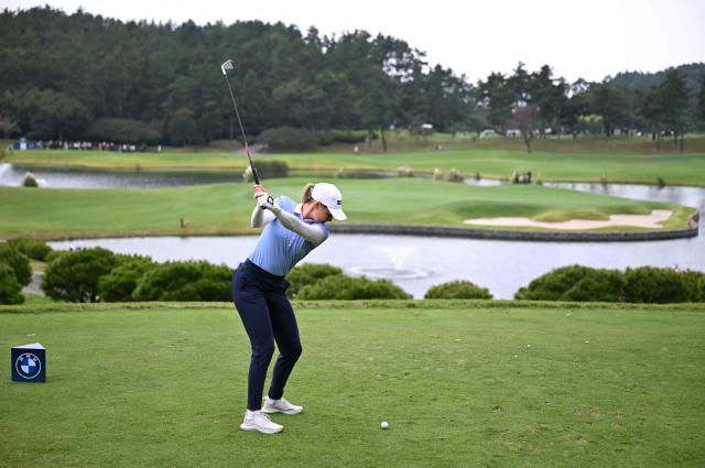 Brooke Matthews of the United States tees off on the 3rd hole during the final round of the LPGA Tour - BMW Ladies Championship golf tournament at Pine Beach Golf Links in Haenam on October 19, 2025. (Photo by Jung Yeon-je / AFP)