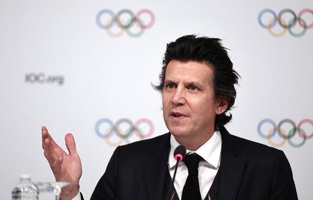 (FILES) Olympic Games Executive Director Christophe Dubi answers journalists' questions during a press conference after an International Olympic Committee (IOC) Executive Board committee meeting in Paris, on November 29, 2023. Split into seven poles, the 2026 Milan-Cortina Olympics inaugurate a model whose success "is fundamental" for the 2030 edition in the French Alps, Christophe Dubi, executive director of the Games at the International Olympic Committee (IOC), told AFP. (Photo by FRANCK FIFE / AFP)
