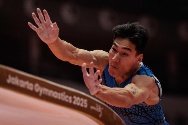 Mogolia's Enkhtuvshin Damdindorj competes on the vault during the men's qualifying session at the 53rd FIG Artistic Gymnastics World Championships In Jakarta on October 19, 2025. (Photo by Yasuyoshi CHIBA / AFP)