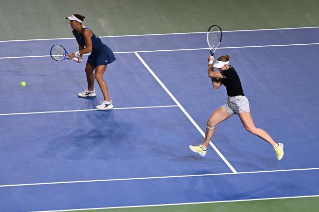 USA's Nicole Melichar-Martinez (L) and Russia’s Liudmila Samsonova play a point against Hungary's Timea Babos and Brazil's Luisa Stefani during their women’s doubles final match at the WTA Ningbo Open tennis tournamen in Ningbo, in China’s eastern Zhejiang province on October 19, 2025. (Photo by AFP) / China OUT