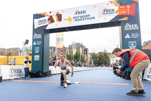 Belgian Nicolai Sake celebrates after winning the marathon race at the Antwerp Marathon running event, in Antwerp on October 19, 2025. (Photo by ZENO DRUYTS / Belga / AFP) / Belgium OUT