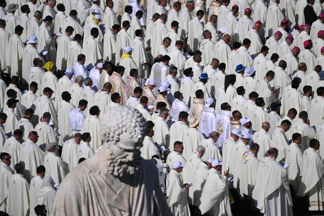 Clergymen attend a mass for the canonization of seven new Saints at St Peter's square in The Vatican, on October 19, 2025. New saints are Ignazio Choukrallah Maloyan, Peter To Rot, Vincenza Maria Poloni, Maria del Monte Carmelo Rendiles Martínez, Maria Troncatti, José Gregorio Hernández Cisneros and  Bartolo Longo. (Photo by Filippo MONTEFORTE / AFP)