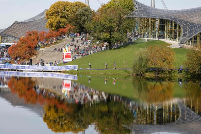 Women on roller skis warm up for the qualifying of the new Biathlon Opening Festival "LOOP ONE" at the Olympiapark in Munich, southern Germany, on October 19, 2025. (Photo by Michaela STACHE / AFP)