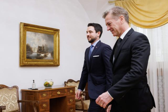 Slovenian Prime Minister Robert Golob (R) welcomes Jordan's Crown Prince Hussein ahead of their meeting in Brdo pri Kranju, on October 19, 2025. (Photo by Luka Dakskobler / AFP)