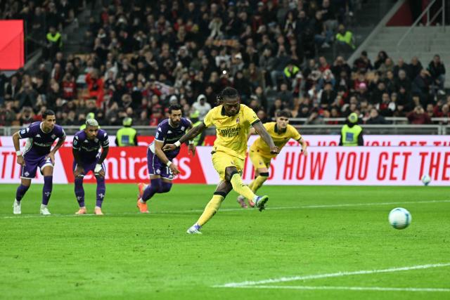 AC Milan's Portuguese forward #10 Rafael Leao kicks and scores a penalty during the Italian Serie A football match between AC Milan and Fiorentina at San Siro stadium in Milan, northern Italy, on October 19, 2025. (Photo by Stefano RELLANDINI / AFP)