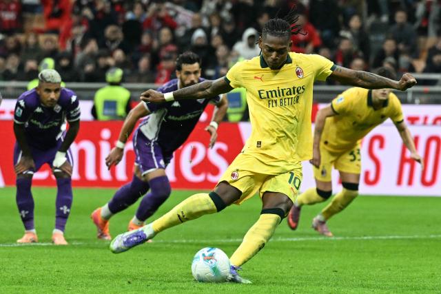 AC Milan's Portuguese forward #10 Rafael Leao kicks and scores a penalty during the Italian Serie A football match between AC Milan and Fiorentina at San Siro stadium in Milan, northern Italy, on October 19, 2025. (Photo by Stefano RELLANDINI / AFP)