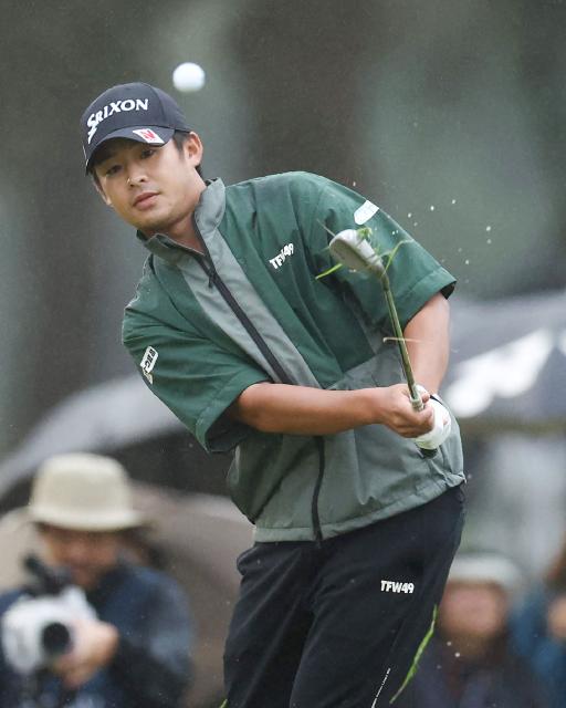 This photo taken on October 19, 2025 shows Naoyuki Kataoka hitting an approach shot on the first hole of the playoff during the Japan Open golf tournament at Nikko Country Club in Nikko, Tochigi prefecture, north of Tokyo. World number 500 Naoyuki Kataoka will make his major debut next year after winning the Japan Open on October 19. (Photo by JIJI Press / AFP) / Japan OUT