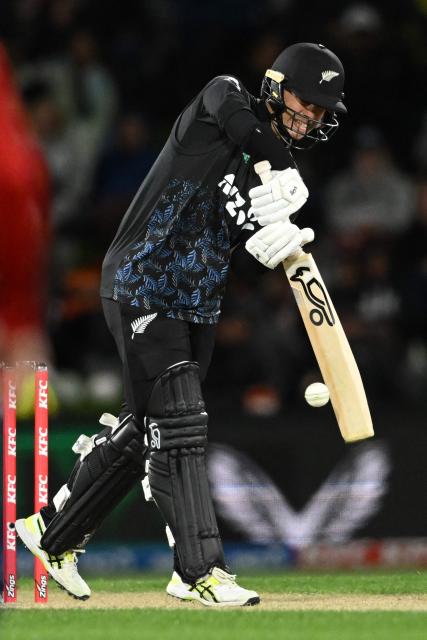 New Zealand's Mark Chapman plays a shot during the second Twenty20 international cricket match between New Zealand and England at Hagley Oval in Christchurch on October 20, 2025. (Photo by Sanka VIDANAGAMA / AFP)