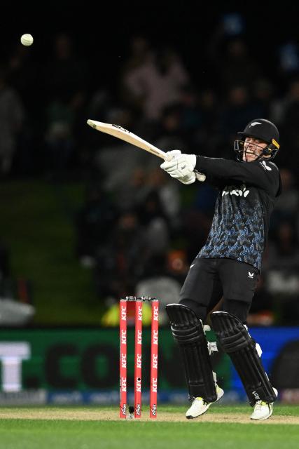 New Zealand's Mark Chapman bats during the second Twenty20 international cricket match between New Zealand and England at Hagley Oval in Christchurch on October 20, 2025. (Photo by Sanka VIDANAGAMA / AFP)