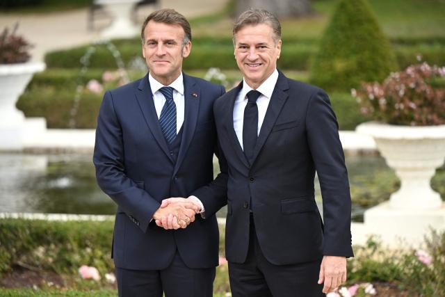 Slovenia's Prime Minister Robert Golob (R) greets France's President Emmanuel Macron at the Med9 Summit of the Mediterranean and Southern European Union member states, in Portoroz, Slovenian Adriatic seaside, on October 20, 2025. (Photo by Jure Makovec / AFP)