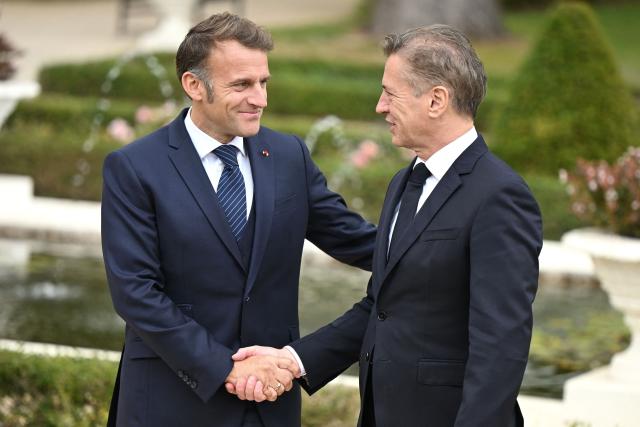 Slovenia's Prime Minister Robert Golob (R) greets France's President Emmanuel Macron at the Med9 Summit of the Mediterranean and Southern European Union member states, in Portoroz, Slovenian Adriatic seaside, on October 20, 2025. (Photo by Jure Makovec / AFP)