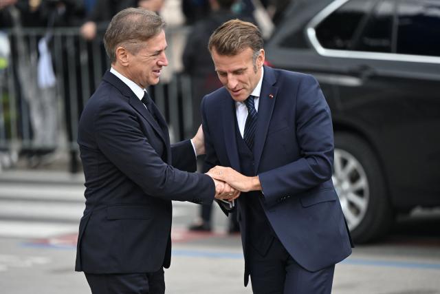 Slovenia's Prime Minister Robert Golob (L) greets France's President Emmanuel Macron at the Med9 Summit of the Mediterranean and Southern European Union member states, in Portoroz, Slovenian Adriatic seaside, on October 20, 2025. (Photo by Jure Makovec / AFP)