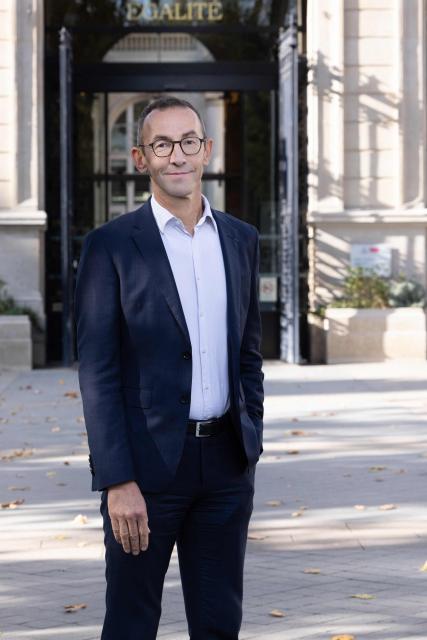 Mayor of Paris' 11th arrondissement Francois Vauglin, of the French Socialist Party (PS), poses for a portrait during a photo session outside the 11th arrondissement district hall in Paris, on October 14, 2025. (Photo by Geoffroy VAN DER HASSELT / AFP)