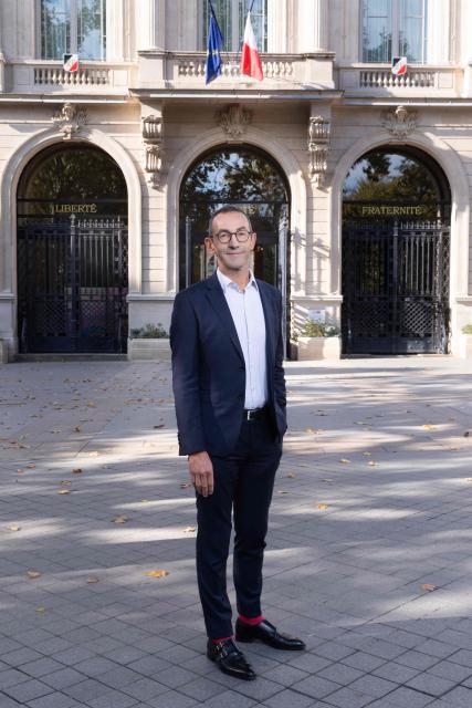 Mayor of Paris' 11th arrondissement Francois Vauglin, of the French Socialist Party (PS), poses for a portrait during a photo session outside the 11th arrondissement district hall in Paris, on October 14, 2025. (Photo by Geoffroy VAN DER HASSELT / AFP)