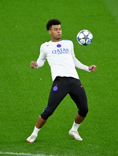 Paris Saint-Germain's French midfielder #14 Desire Doue takes part in a training session on the eve of the UEFA Champions League league phase football match between Bayer 04 Leverkusen and Paris Saint-Germain (PSG) at the BayArena stadium in Leverkusen, western Germany on October 20, 2025. (Photo by Ina FASSBENDER / AFP)