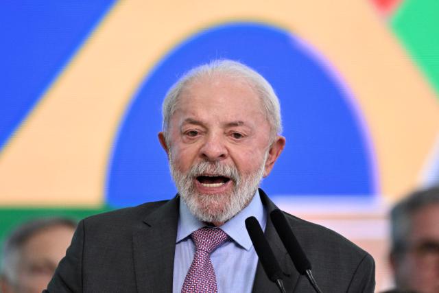 Brazil's President Luiz Inacio Lula da Silva delivers a speech during the launch of a home renovation program for low-income families at Planalto Palace in Brasilia on October 20, 2025. (Photo by Evaristo Sa / AFP)