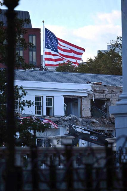 Heavy machinery tears down a section of the East Wing of the White House as construction begins on President Donald Trumps planned ballroom, in Washington, DC, on October 20, 2025. US President Donald Trump held a glitzy dinner October 15, 2025 to thank billionaires and top companies for donating to the new $250 million ballroom he is building at the White House. The guests included representatives from tech firms like Amazon, Apple, Meta, Google, Microsoft and Palantir and defense giant Lockheed Martin, according to US media citing a White House guest list. (Photo by Pedro UGARTE / AFP)