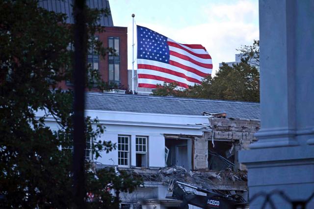 Heavy machinery tears down a section of the East Wing of the White House as construction begins on President Donald Trumps planned ballroom, in Washington, DC, on October 20, 2025. US President Donald Trump held a glitzy dinner October 15, 2025 to thank billionaires and top companies for donating to the new $250 million ballroom he is building at the White House. The guests included representatives from tech firms like Amazon, Apple, Meta, Google, Microsoft and Palantir and defense giant Lockheed Martin, according to US media citing a White House guest list. (Photo by Pedro UGARTE / AFP)